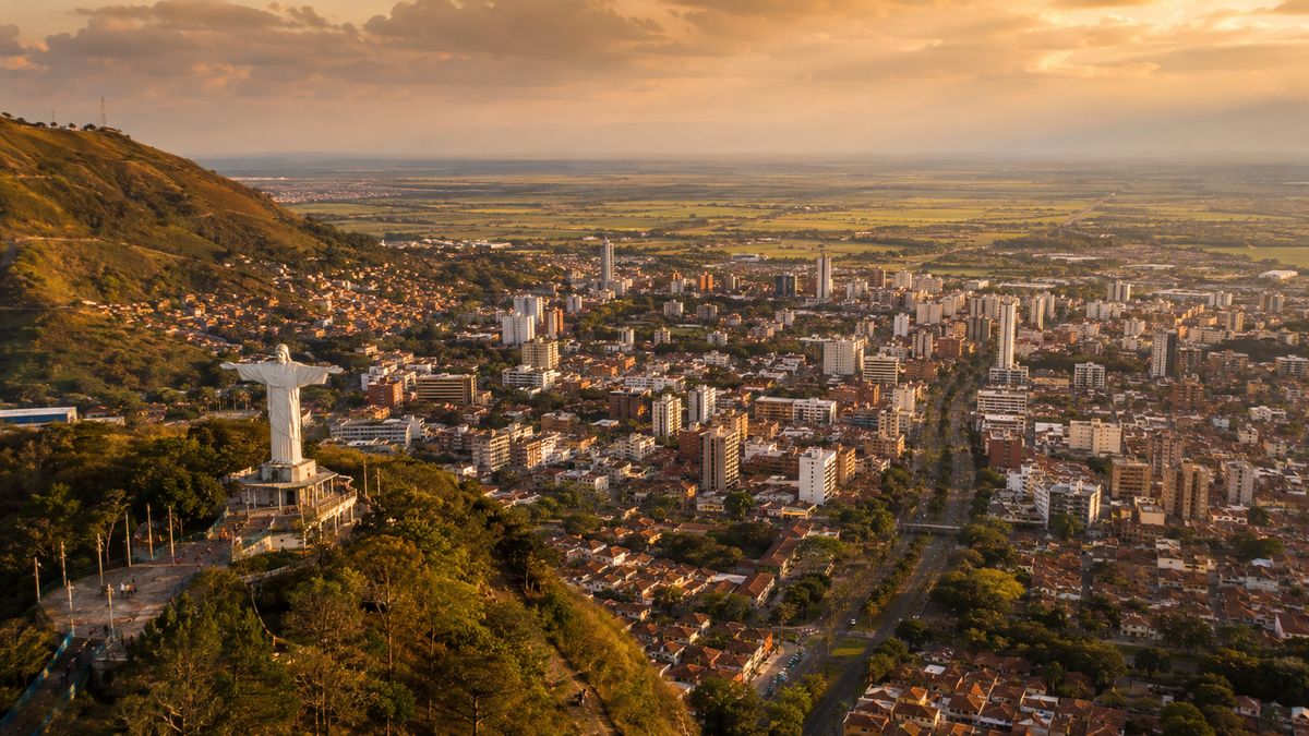 Cali Colombia aerial view with Cristo Rey statue at sunset